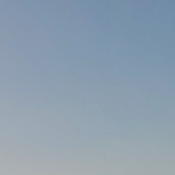 ビルと夕陽の写真